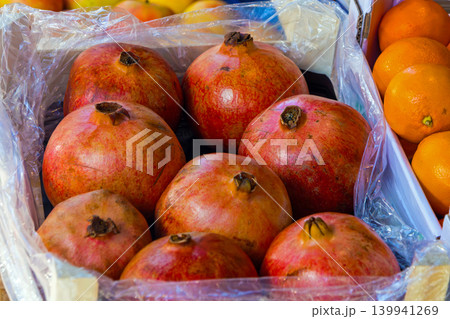 Pomegranate in market crate Pomegranate in market crate 139941269