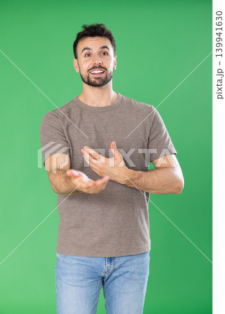 Portrait of adult man posing on green screen. Chroma key compositing 139941630