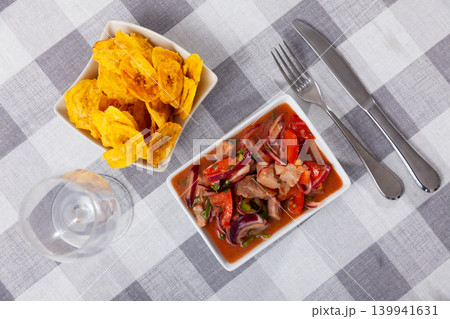 Ceviche served with fried banana in bowl Ceviche served with fried banana in bowl 139941631