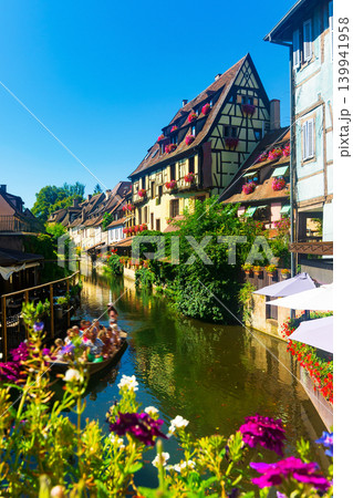 Colmar is a picturesque old town with beautiful traditional half-timbered houses. France Colmar is a picturesque old town with beautiful traditional half-timbered houses. France 139941958
