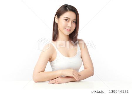 A beautiful young Asian woman with clean, fresh skin against a white background. Skincare, facial treatment, cosmetology, beauty, and spa. An elegant portrait of an Asian woman. A beautiful young Asian woman with clean, fresh skin against a white background. Skincare, facial treatment, cosmetology, beauty, and spa. An elegant portrait of an Asian woman. 139944181