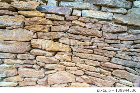 Backgrounds of the old stone wall. 139944330