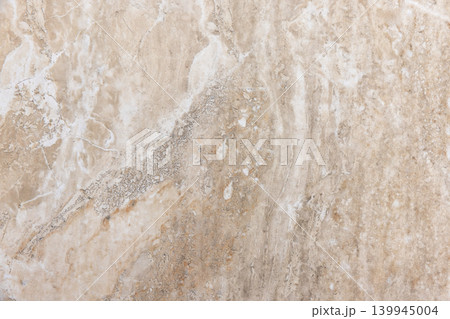 Beige marble surface with subtle veins and organic mineral patterns 139945004