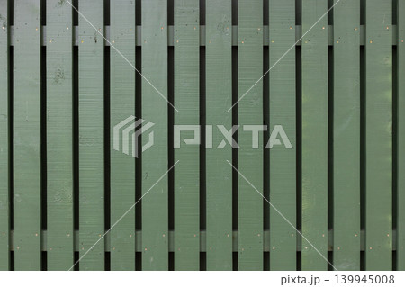 Wooden fence background texture, green vertical planks Wooden fence background texture, green vertical planks 139945008