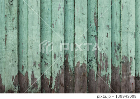 Texture of weathered wooden wall with green peeling paint Texture of weathered wooden wall with green peeling paint 139945009