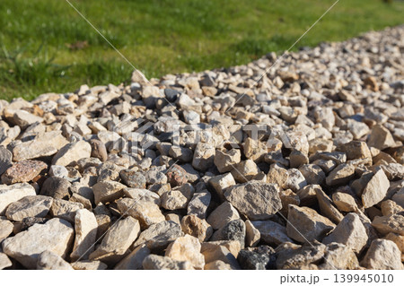 Close-up view of light-colored gravel and rocks used for landscaping Close-up view of light-colored gravel and rocks used for landscaping 139945010