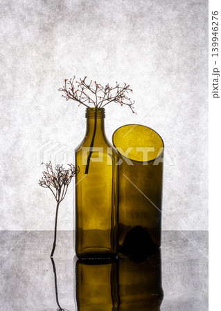 Still life with glass objects and a dry twig Still life with glass objects and a dry twig 139946276