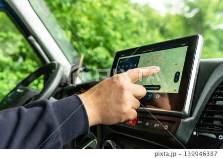 Driver operating car GPS navigation system Driver operating car GPS navigation system 139946387