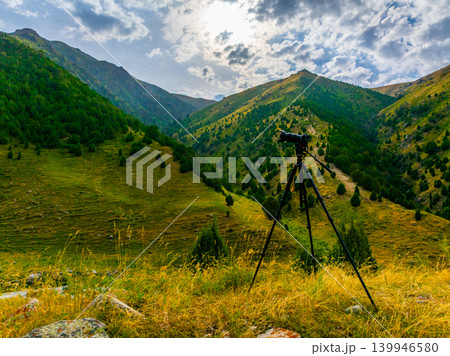 Camera on Tripod Capturing Mountain Landscape Vista in Kyrgyzstan 139946580