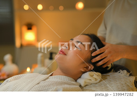 Gorgeous asian woman a facial massage in spa 139947282