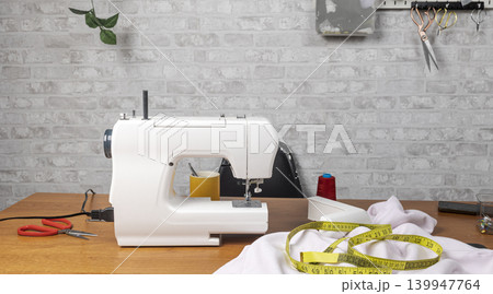 Sewing machine work table with tailoring tools Sewing machine work table with tailoring tools 139947764