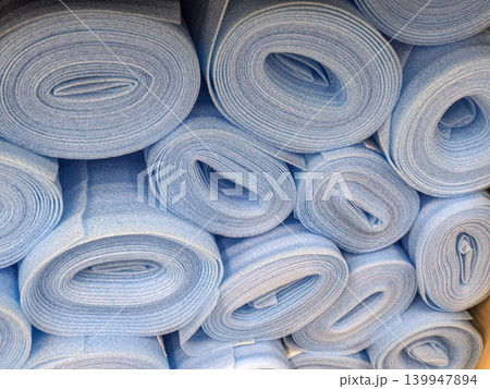 Stack of Blue Foam Underlayment Rolls for Flooring Stack of Blue Foam Underlayment Rolls for Flooring 139947894