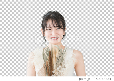 A smiling Japanese woman holding a bouquet of flowers (for a birthday, gift, or Mother's Day). 139948284
