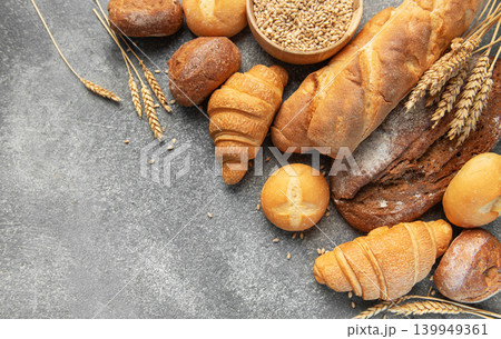 Assortment of fresh bread and pastries on gray background 139949361