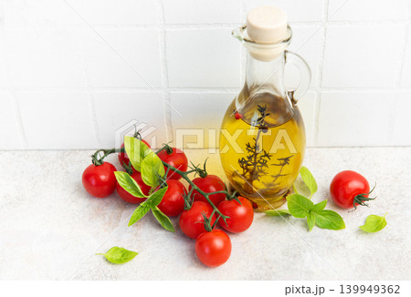 Olive oil bottle with fresh cherry tomatoes basil 139949362