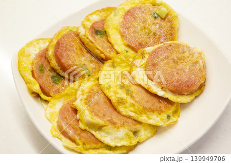 It is a pink sausage dish 139949706
