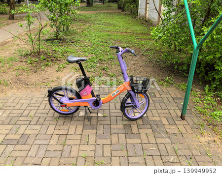 High Angle View of Shared Electric Bike on Sidewalk High Angle View of Shared Electric Bike on Sidewalk 139949952