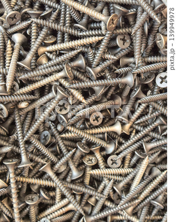 Close Up Pile of Metal Screws and Fasteners Background Texture Close Up Pile of Metal Screws and Fasteners Background Texture 139949978