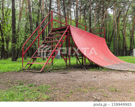 Low Angle View of Extreme Sports Red Ramp in Forest Low Angle View of Extreme Sports Red Ramp in Forest 139949983