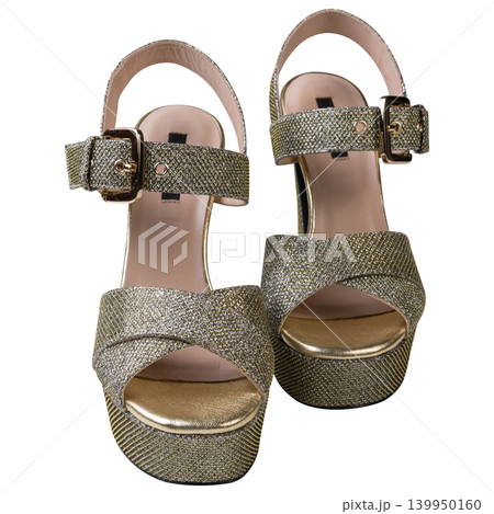 Gold glitter platform sandals with high heels isolated on white background, front view Gold glitter platform sandals with high heels isolated on white background, front view 139950160
