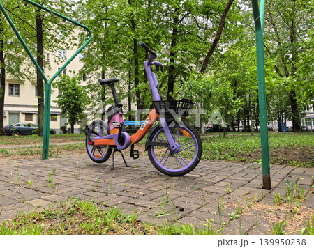Shared Electric Bicycle Parked Under Metal Arch Frame 139950238