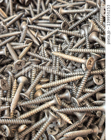 Close Up Pile of Metal Screws Background Texture Close Up Pile of Metal Screws Background Texture 139950253