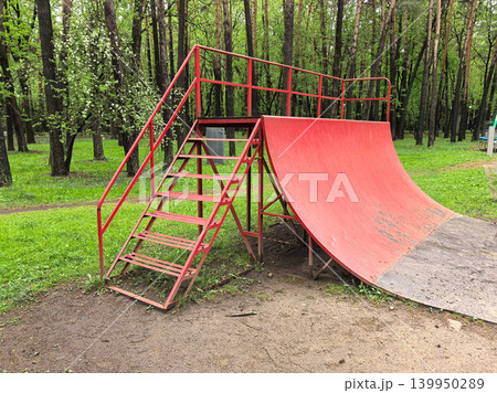 High Angle Shot of Red Metal Skate Quarter Pipe High Angle Shot of Red Metal Skate Quarter Pipe 139950289