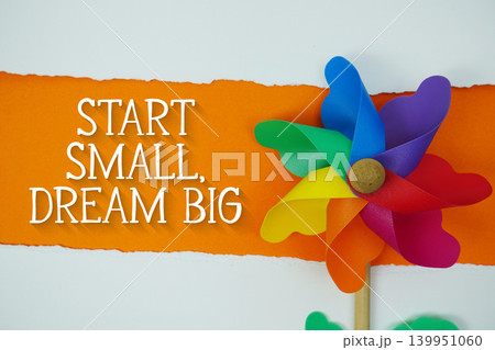 Start Small, Dream Big motivational and inspirational quotes message on orange background 139951060