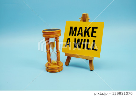 Make a Will text with hourglass on blue background Make a Will text with hourglass on blue background 139951070