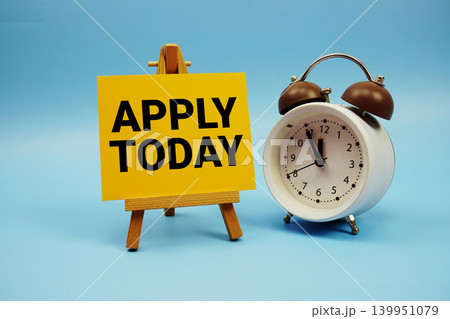 Apply Today text with alarm clock on blue background 139951079
