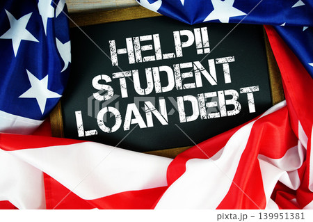 American flag with blackboard "Help!! Student Loan Debt" on wooden background American flag with blackboard "Help!! Student Loan Debt" on wooden background 139951381