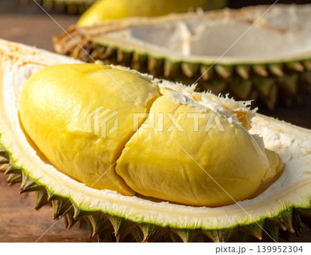 Durian riped and fresh durian peel with yellow colour fruit Durian riped and fresh durian peel with yellow colour fruit 139952304