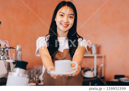 Young woman at barista school learning how to make espresso coffee. 139952399