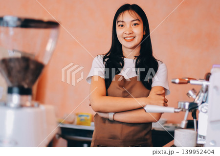 Young woman at barista school learning how to make espresso coffee. Young woman at barista school learning how to make espresso coffee. 139952404