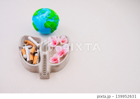 No Tobacco Day concept with lungs shape cigarettes and flowers on neutral background No Tobacco Day concept with lungs shape cigarettes and flowers on neutral background 139952631