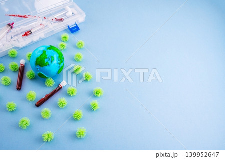 HIV blood testing and global virus research concept with medical syringes and laboratory tubes on blue background 139952647