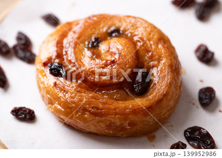 French Pain au Raisin, Cinnamon Raisin Swirl on plate, Delicious breakfast French Pain au Raisin, Cinnamon Raisin Swirl on plate, Delicious breakfast 139952986