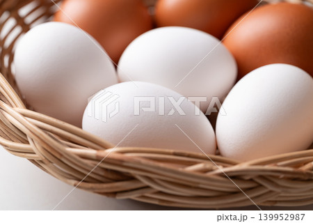 Organic white and brown eggs from free range farm in a basket Organic white and brown eggs from free range farm in a basket 139952987