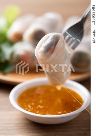 Thai Fresh Spring Rolls with Herbs and Vegetables eating with spicy dipping sauce Thai Fresh Spring Rolls with Herbs and Vegetables eating with spicy dipping sauce 139952995