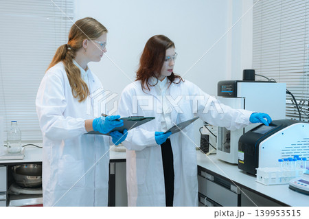 Diverse Scientists Conduct Biotechnology Research in Modern Laboratory 139953515