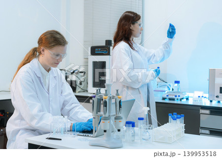 Diverse Scientists Conduct Biotechnology Research in Modern Laboratory 139953518