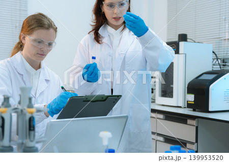 Diverse Scientists Conduct Biotechnology Research in Modern Laboratory 139953520