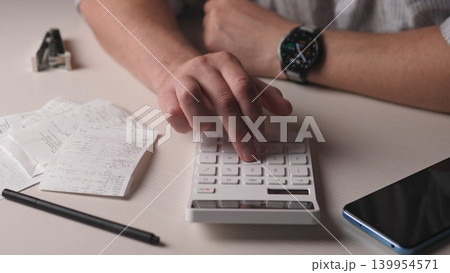 Wide View Hands Reconciling Receipts With Calculator, Phone And Pencil On Desk, Organized Stacks Of Invoices And Notes, Smartwatch Visible, Methodical Tallying Of Monthly Totals And Financial Records Wide View Hands Reconciling Receipts With Calculator, Phone And Pencil On Desk, Organized Stacks Of Invoices And Notes, Smartwatch Visible, Methodical Tallying Of Monthly Totals And Financial Records 139954571
