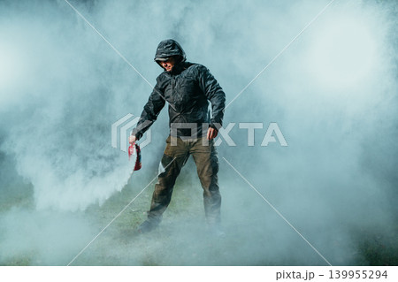 Young man testing fire extinguisher Young man testing fire extinguisher 139955294