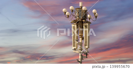 Street lamp on Tiananmen Square in Beijing, China (against the sunset), with propaganda or public announcement speakers Street lamp on Tiananmen Square in Beijing, China (against the sunset), with propaganda or public announcement speakers 139955670