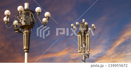 Street lamp on Tiananmen Square in Beijing, China (against the sunset), with propaganda or public announcement speakers Street lamp on Tiananmen Square in Beijing, China (against the sunset), with propaganda or public announcement speakers 139955672