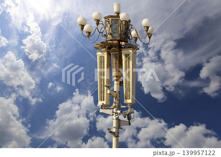 Street lamp on Tiananmen Square in Beijing, China (against the background of a beautiful sky with clouds), with propaganda or public announcement speakers Street lamp on Tiananmen Square in Beijing, China (against the background of a beautiful sky with clouds), with propaganda or public announcement speakers 139957122