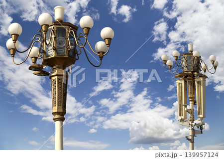 Street lamp on Tiananmen Square in Beijing, China (against the background of a beautiful sky with clouds), with propaganda or public announcement speakers 139957124