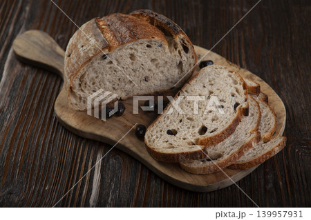 Rustic Olive Bread Presentation on Wood Background. 139957931