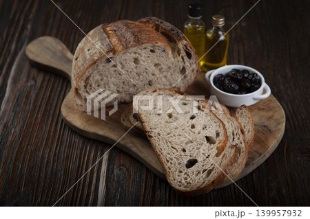 Rustic Olive Bread Presentation on Wood Background. Rustic Olive Bread Presentation on Wood Background. 139957932